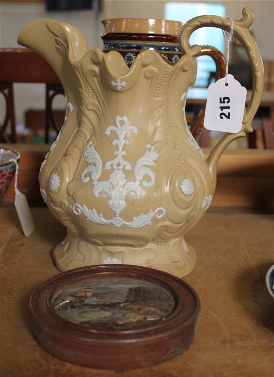 Doulton jug stoneware jug and a framed pot lid (3)